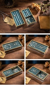 Macro view of vintage velvet jewelry tray with gold borders for rings and bracelets