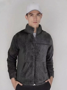 Detail of dark grey fleece jacket with standing collar and warm thermal texture