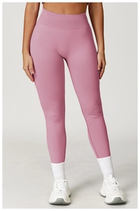 Detail of high waist seamless yoga leggings in dusty rose with ribbed texture design