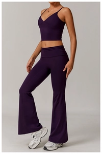 Detail of dark purple V-neck yoga crop top and high-waisted flared leggings set