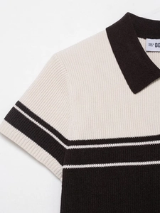 Close-up of ribbed knit polo collar with contrast stripes and fine textured fabric