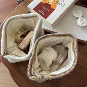 Sherpa fleece makeup bag set in white and khaki featuring metal zipper and soft texture