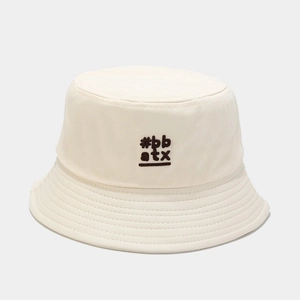 Close-up of cream cotton bucket hat featuring #bb atx embroidery and stitched brim details