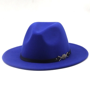 Detail of royal blue wide brim fedora hat with black ribbon and silver fish buckle