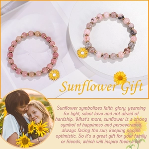Detail of pink zebra stone bead bracelet with yellow sunflower pendant for women