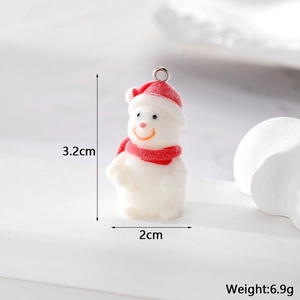 Macro view of flocked snowman charm with red hat, scarf and dimensional measurements