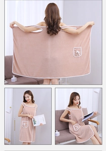 Detail of coral fleece wearable bath towel with pocket and pink absorbent fabric