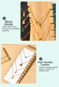 Detail view of wooden necklace display stand showing metal hooks and premium white padding