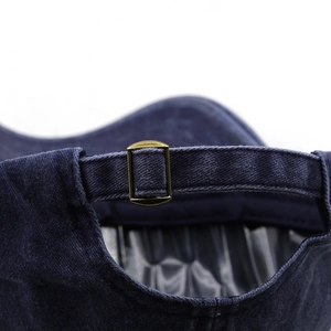 Deep blue corduroy baseball cap with adjustable metal buckle and embroidery detail