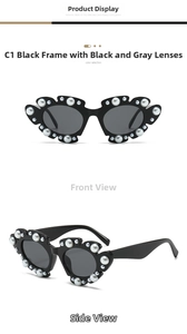 Detail of vintage cat-eye sunglasses with pearl-embellished black frames and gray lenses