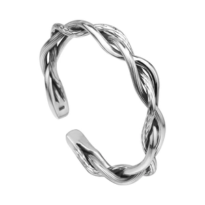 Macro detail of silver twisted multi-strand braided design on an open cuff bracelet