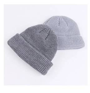 Detailed view of the fine knitting texture on these gray winter beanie hats