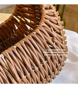 Macro shot of the reddish-brown woven rattan texture and intricate 3D braided craftsmanship