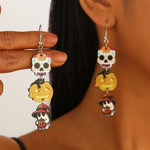 Three-tier Halloween drop earrings with sugar skull pumpkin and ghost charms on model