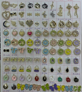 Selection of alloy charms with zircons and pearls for DIY jewelry making and craft projects