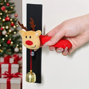 Close-up of red knitted Christmas door handle cover with plush reindeer and gold bell