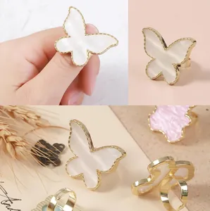 Japanese style butterfly shell ring with adjustable gold trim and resin inlay details