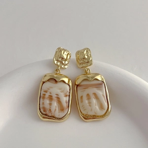 Minimalist square resin drop earrings with gold metal texture and marble pattern