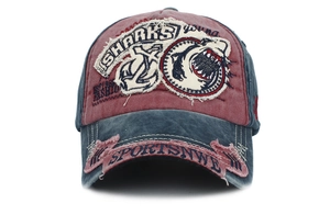 Close-up of vintage distressed cotton baseball cap with shark embroidery and patches