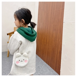 Detail view of white plush bear crossbody bag with cute embroidery for young girls