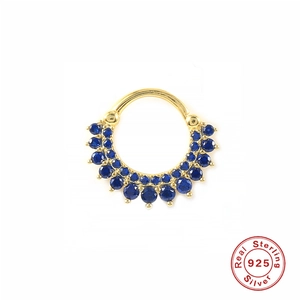 Macro shot of 925 sterling silver gold nose ring with double rows of blue rhinestones