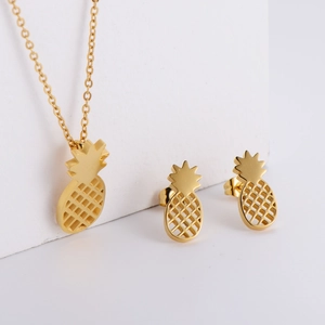 Elegant gold plated stainless steel jewelry set featuring hollow pineapple pendant and earrings