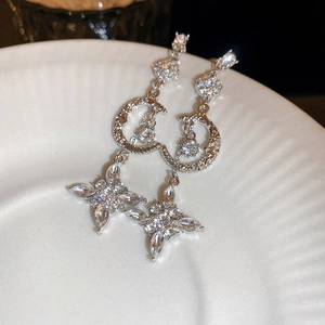 Elegant silver star and moon tassel earrings with sparkling rhinestones for women