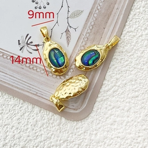 Macro detail of 14x9mm 18k gold plated abalone shell heart pendant for DIY jewelry