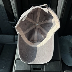 Vintage washed grey-purple canvas baseball cap with interior lining and metal buckle