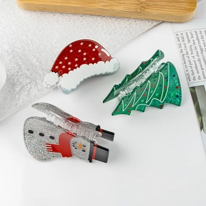 Christmas hair claw clip set featuring Santa hat and tree designs in glittery acrylic
