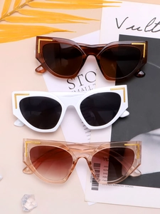 Detailed view of cat eye sunglasses in tortoiseshell, white and pink with gold accents