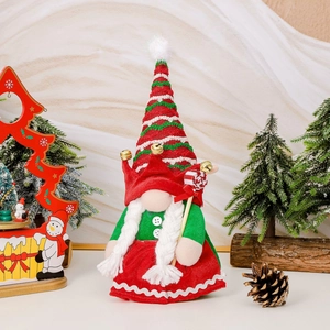 Christmas gnome doll with striped hat and candy cane, festive holiday decoration