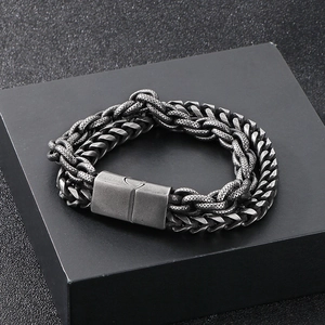 Detail of multi-layer woven chain bracelet in antique silver finish with magnetic clasp