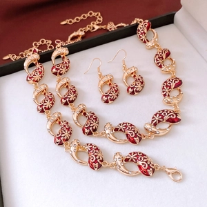 Detail of vintage gold necklace and teardrop zircon earring set in gift box
