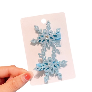 Sparkling light blue snowflake hair clips for girls with rhinestones on display card