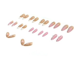 Gradient pink almond press-on nails with 3D floral accents and seashell texture shells