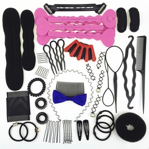 Detailed flat lay of a 30-piece hair styling set with tools, clips, and foam buns