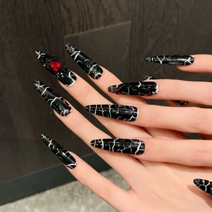Gothic dark style press-on nails with black marble pattern and 3D spider charms