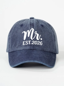 Detail of washed blue cotton baseball cap featuring white Mr. EST.2026 printed text
