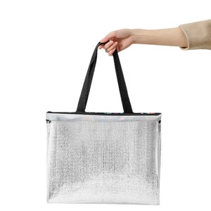 Large silver insulated picnic bag with black handles and aluminum foil interior lining