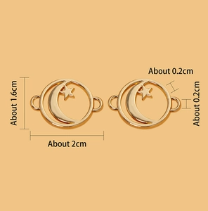 Detail view of gold celestial charm showing 2cm width and 1.6cm height dimensions