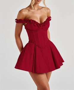 Detailed view of dark red off-shoulder corset dress with delicate eyelet lace embroidery