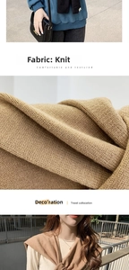Close-up of thick knitted shoulder shawl fabric texture in camel and dark brown colors