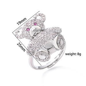 Cute adjustable silver bear ring with sparkling crystals and red eyes on white background