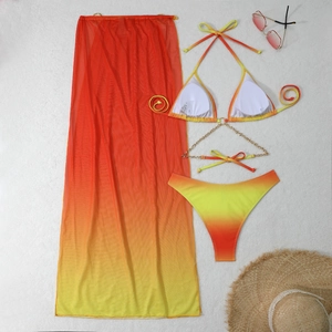 Detail of gradient bikini set with gold chain trim and matching mesh long skirt