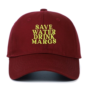 Detail of embroidered Save Water Drink Margs slogan on burgundy cotton baseball cap