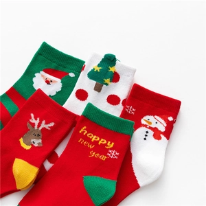 Cute cartoon Christmas socks set for kids in red, green and white festive colors