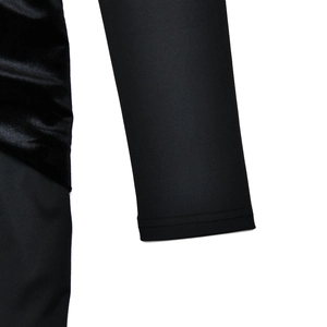 Close-up detail of smooth fabric stitching and luxury velvet texture on the sleeve cuff