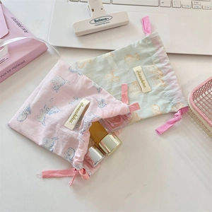 Cute drawstring pouches with cat prints for organizing cosmetics and travel essentials