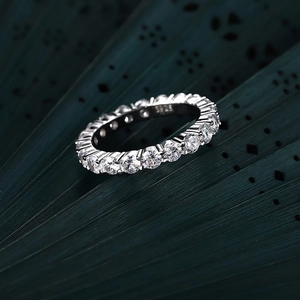 Macro shot of S925 sterling silver stamp and sparkling pave eternity ring band